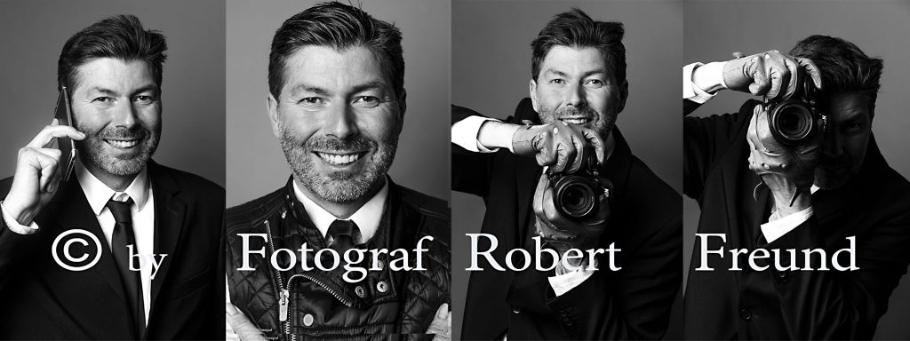 Porträt von Fotograf Robert Freund aus Düsseldorf mit Kamera und im Anzug